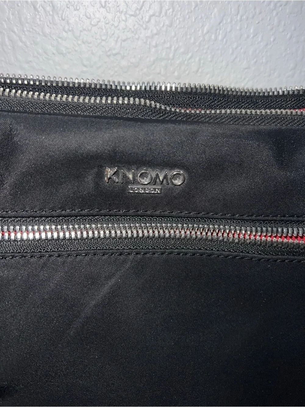 Knomo Black Nylon Messenger Bag with Red Accents